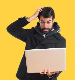 Confused person checking a laptop — no online presence red flag