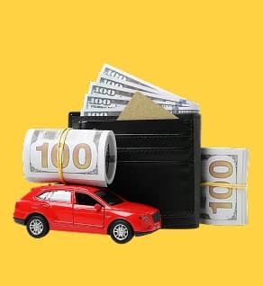 Car beside a wallet of cash — price-change-on-arrival red flag