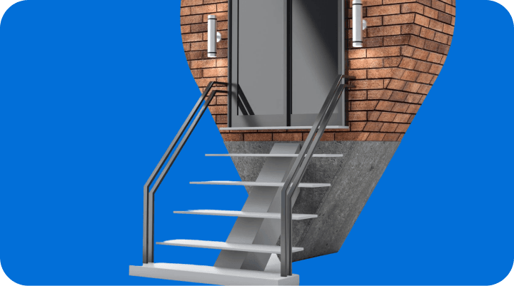 Giant Van two-person crew carrying a dining table upstairs in a UK flat with no lift access.