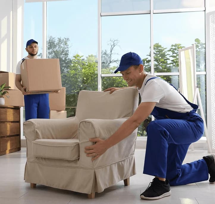 Mover loading a van on moving day for a studio flat removal.