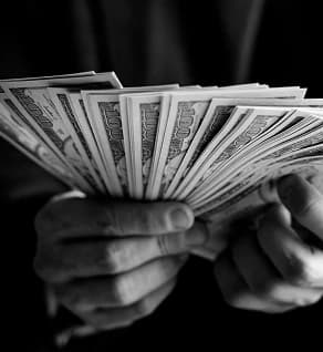 Close-up of British currency notes — fixed, transparent pricing.