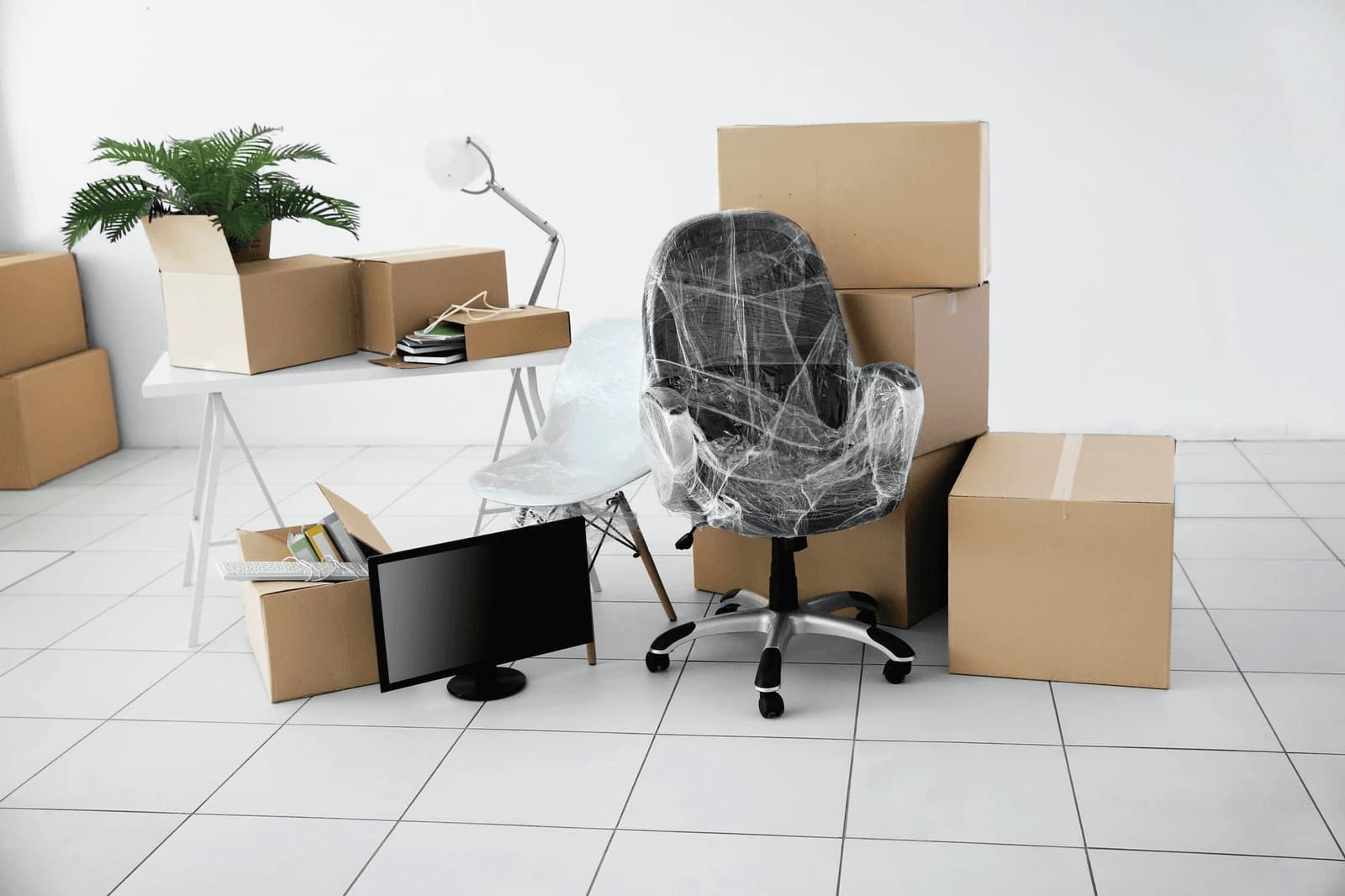 Giant Van crew reassembling desks and setting up a small office after a move