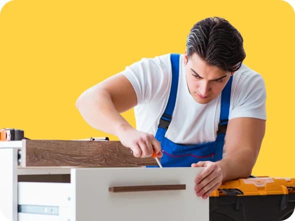 Giant Van crew disassembling modular desks during an office furniture removal