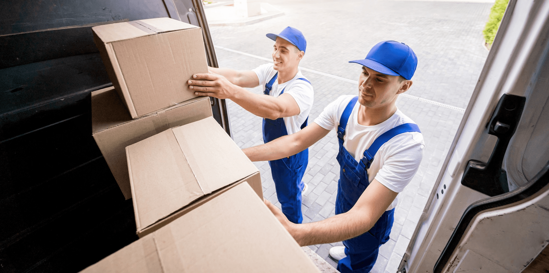 Giant Van crew carefully moving wrapped office furniture