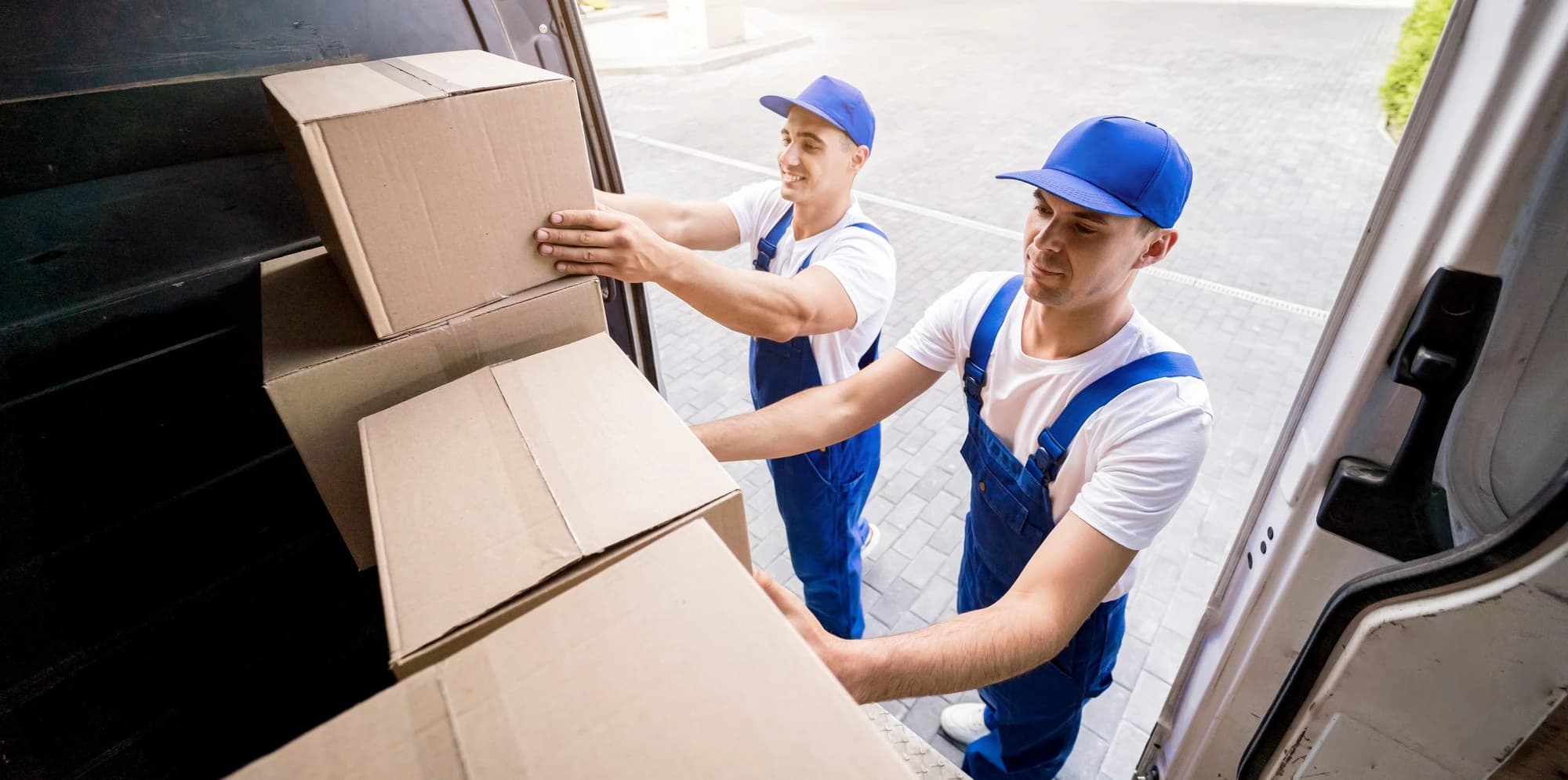Giant Van crew carefully moving wrapped office furniture