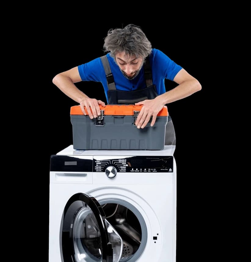 An engineer reconnecting a washing machine after delivery