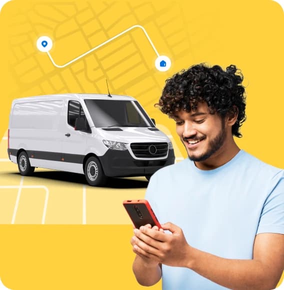 Two Giant Van drivers shaking hands beside a branded van with a route map