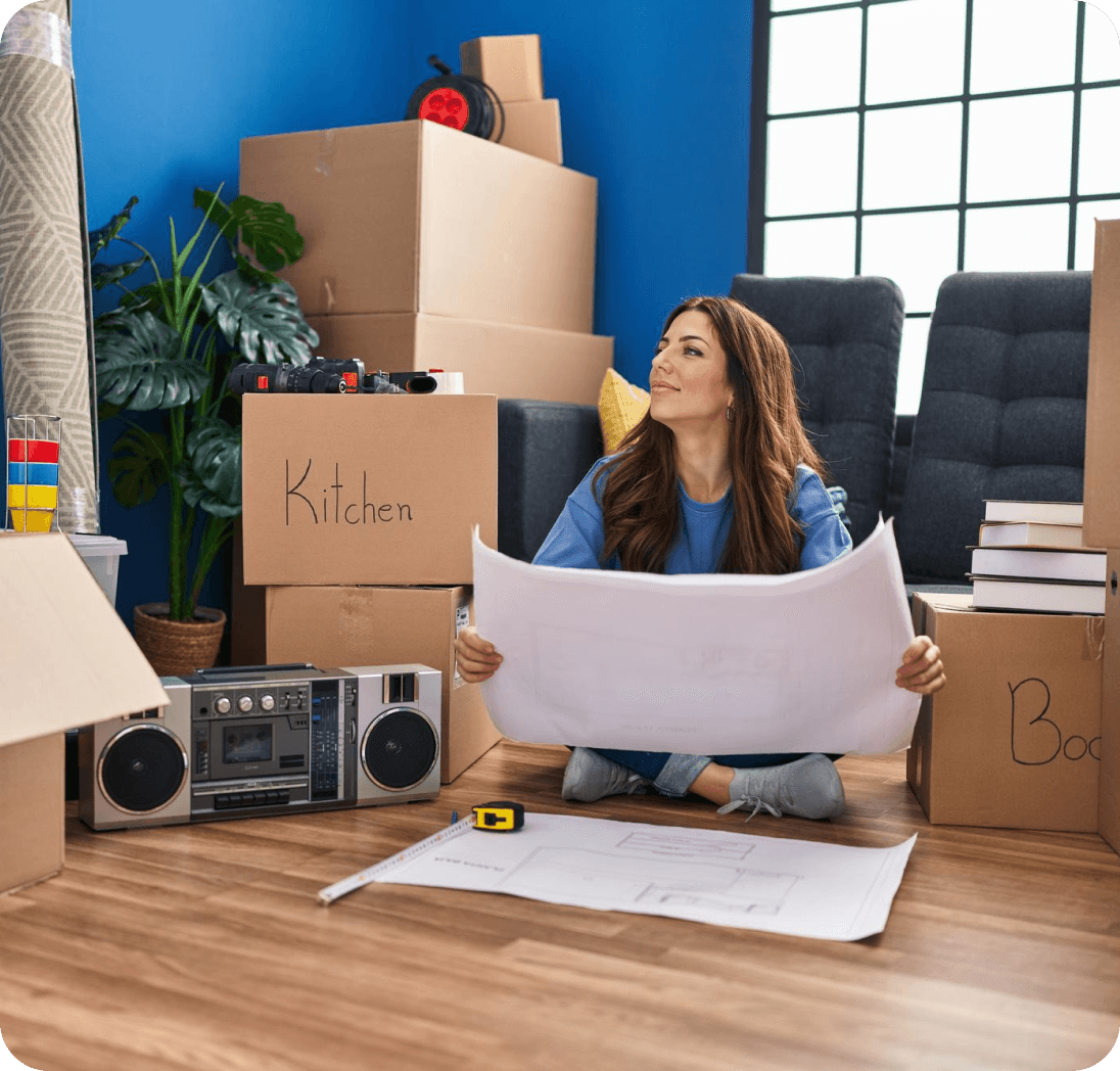 A new Giant Van team member unpacking boxes in a bright home office