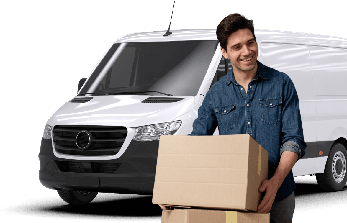 Giant Van team member smiling while carrying a moving box