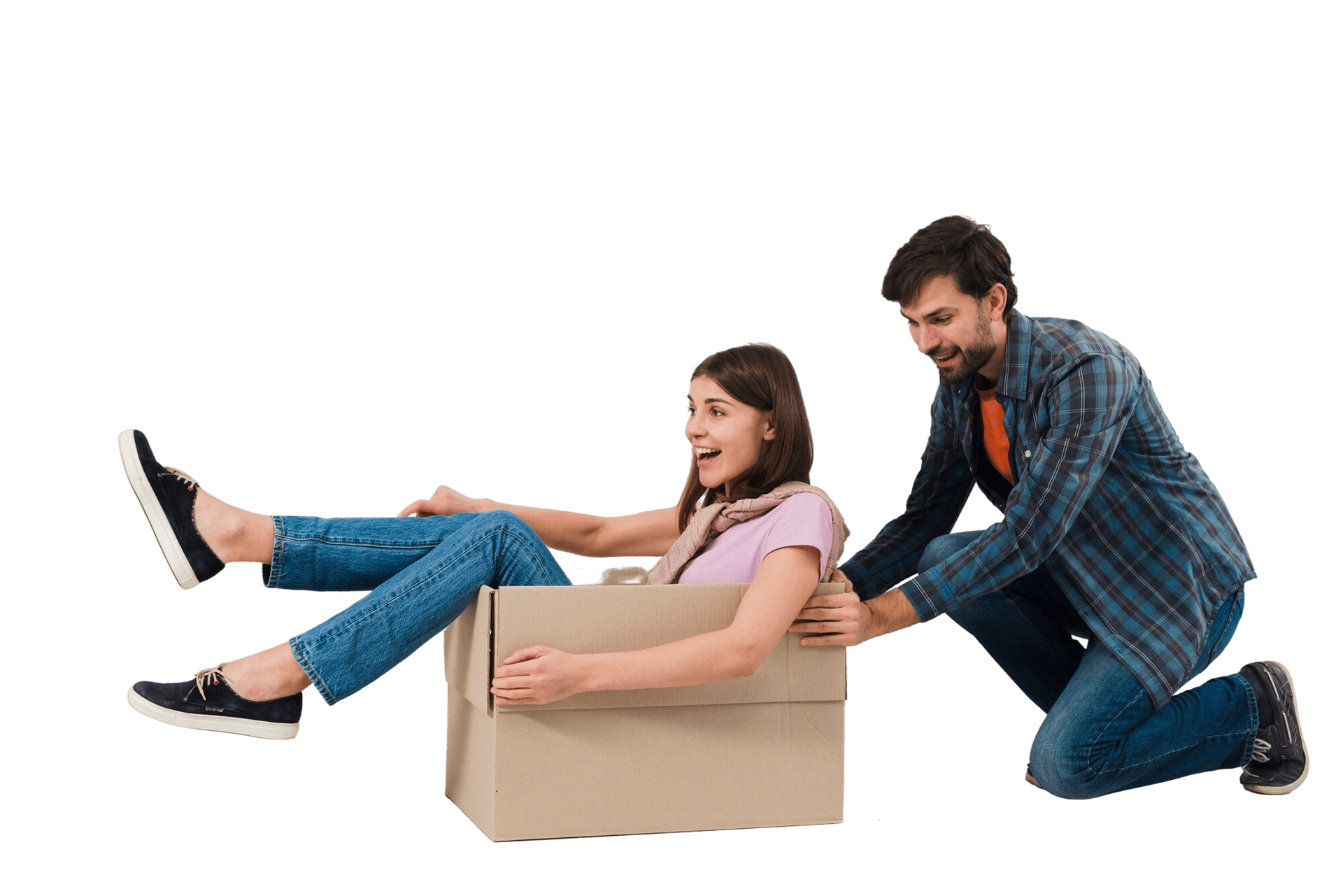 Two people happily moving — woman sitting in a cardboard box being pushed by a man, both smiling