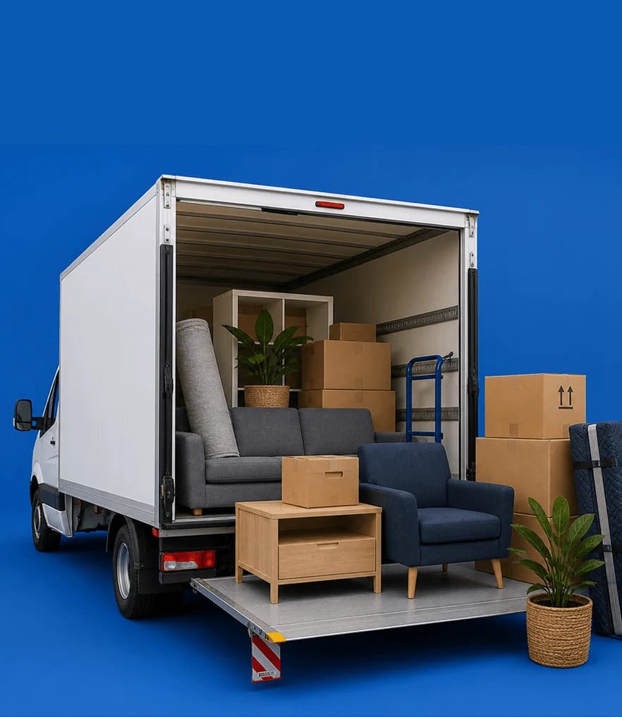 Luton van with the tail lift deployed, loaded with a sofa, armchair and moving boxes