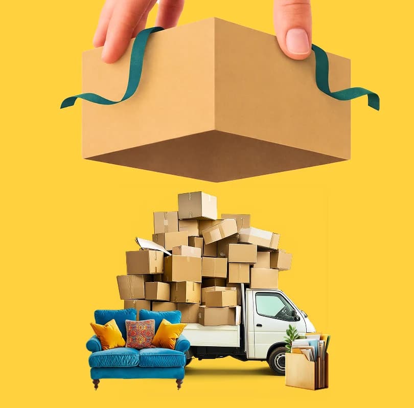 Hand lifting a cardboard box above a stack of boxes, a sofa and a loaded van