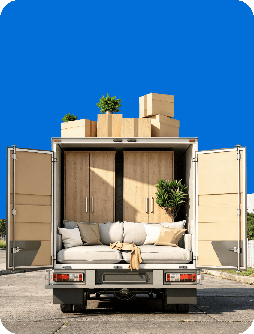 Giant Van crew navigating a wardrobe through a tight UK doorway during wardrobe delivery.